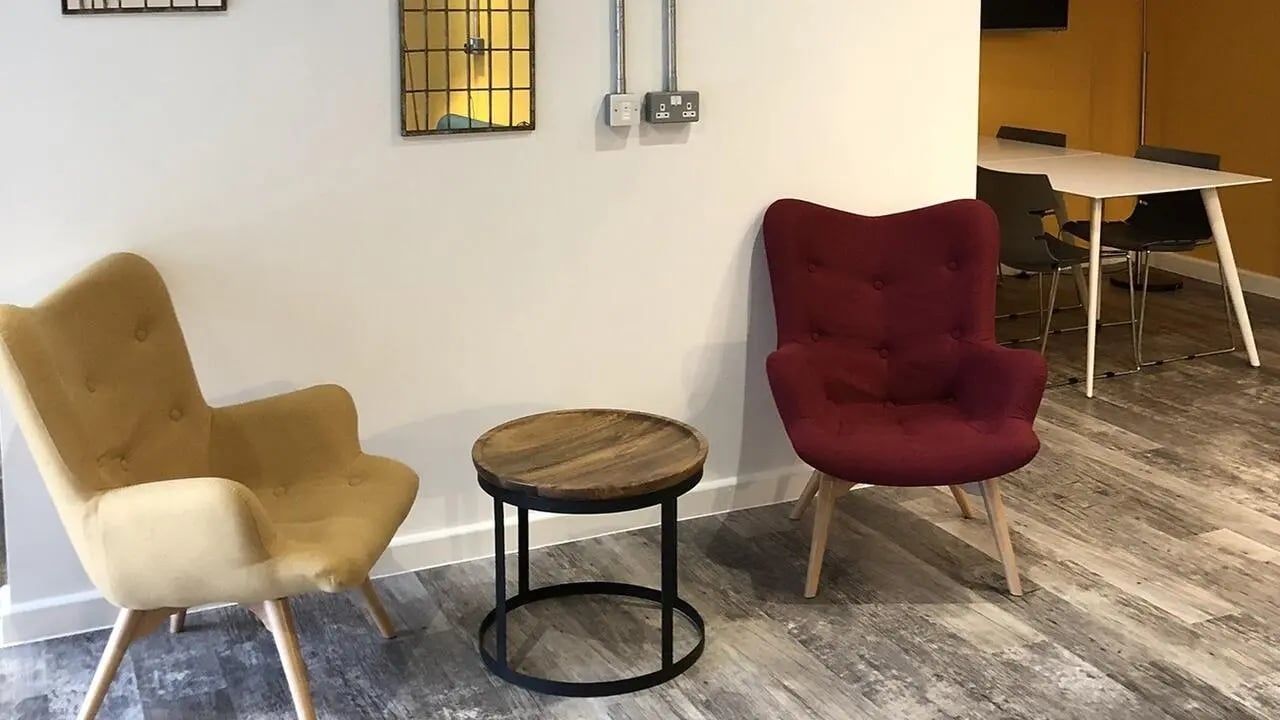 Two chairs and table communal area living room at Collegiate Riverside Way Winchester in Winchester Student Accommodation