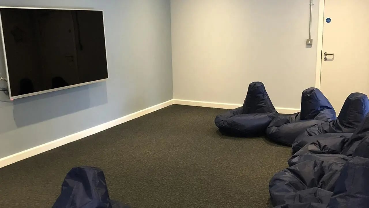 Large TV bean bags carpeted floor common room at Collegiate Riverside Way Winchester in Winchester Student Accommodation