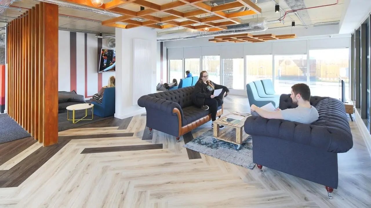 Chesterfield sofas and beanbags communal living area at Collegiate Cathedral Point in Winchester Student Accommodation