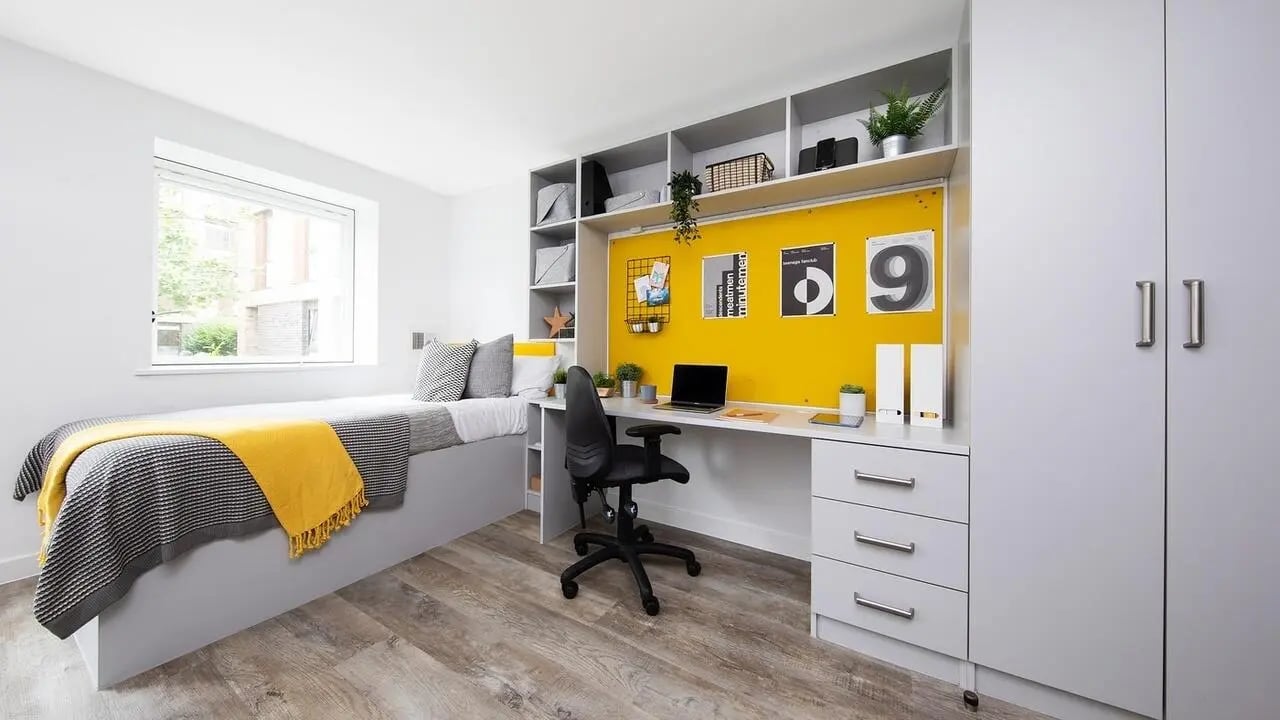 Bed desk chair shelves and wardrobe bedroom at Collegiate Cathedral Point in Winchester Student Accommodation