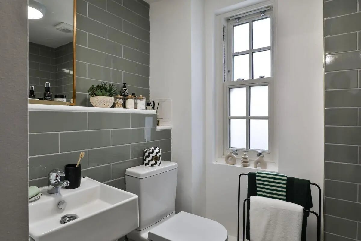 Sink toilet shelving window towel rack bathroom at Talbot Postgrad Studios in Nottingham Student Accommodation