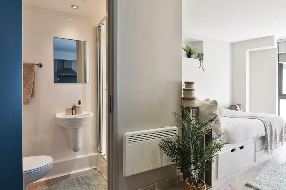 Toilet sink towels and bed Bedroom area at Trippet Lane in Sheffield Student Accommodation