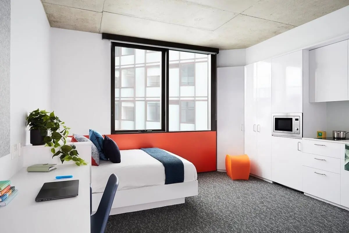 Bed desk plant microwave cabinets student studio at Scape Toowong in Brisbane Student Accommodation