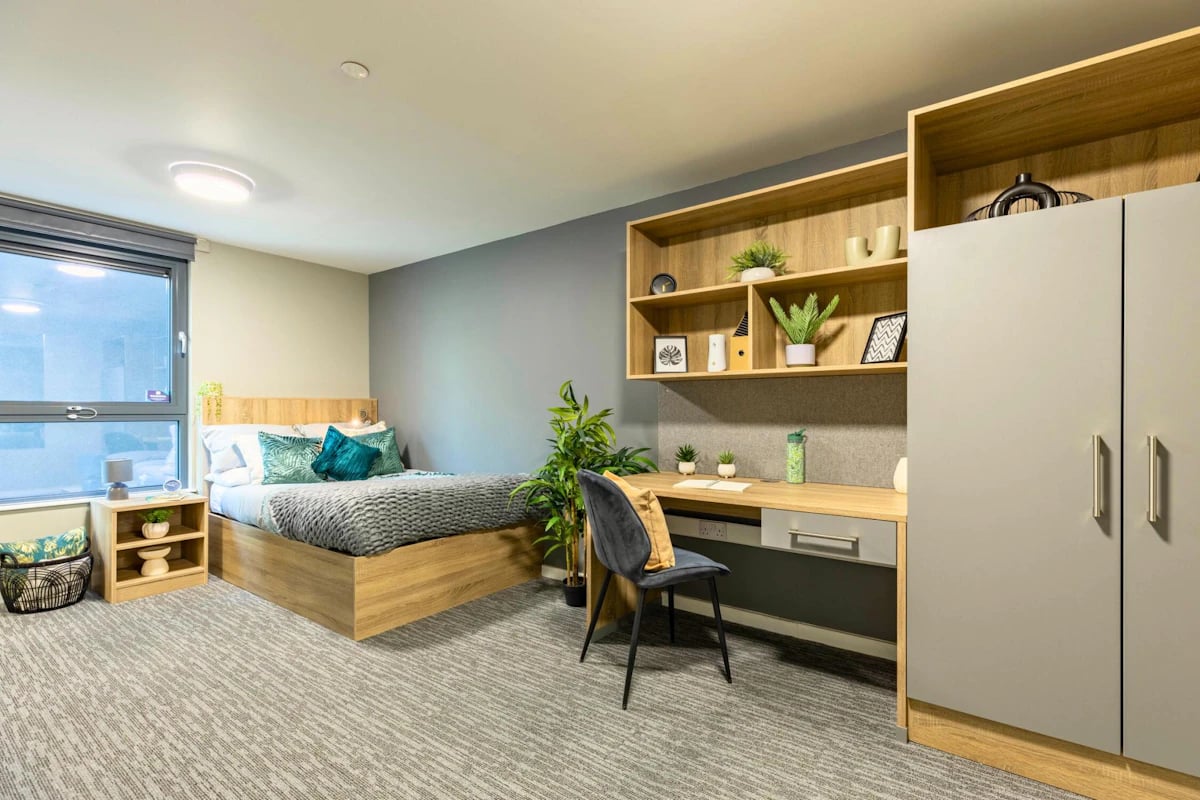 Bed desk chair shelves wardrobe bedroom at Justice Mill Studios in Aberdeen Student Accommodation