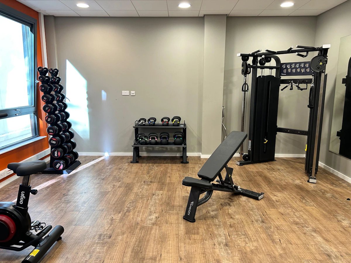 Dumbbell racks kettlebells bench cable machine gym at Justice Mill Studios in Aberdeen Student Accommodation