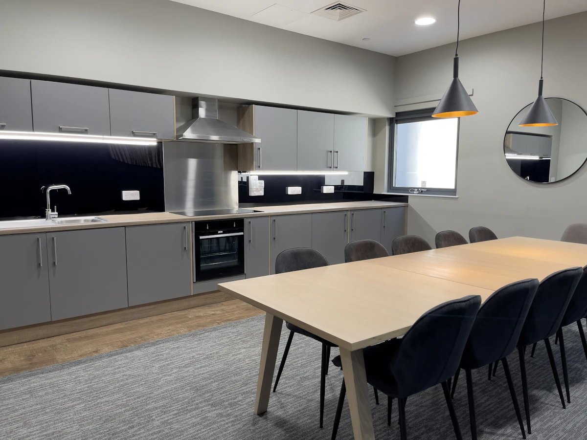 Kitchen with dining table and chairs kitchen area at Justice Mill Studios in Aberdeen Student Accommodation