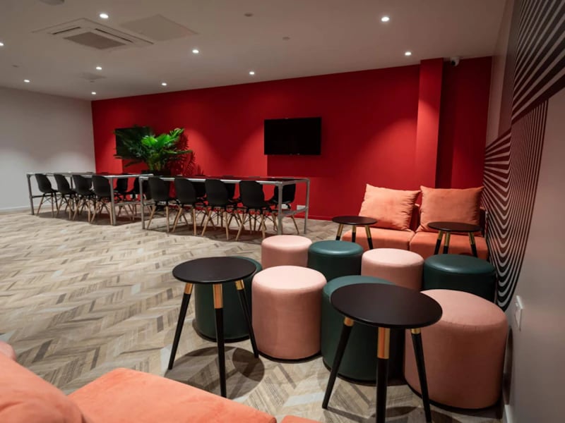 Sofa seating table plant and chairs common area at Steelworks in Sheffield Student Accommodation