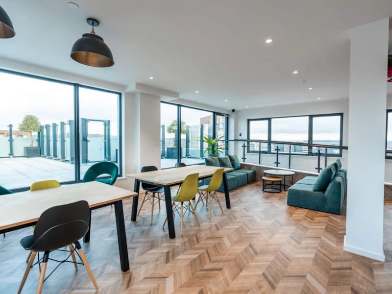 Modern lounge area with tables sofas and chairs Living room at Steelworks in Sheffield Student Accommodation