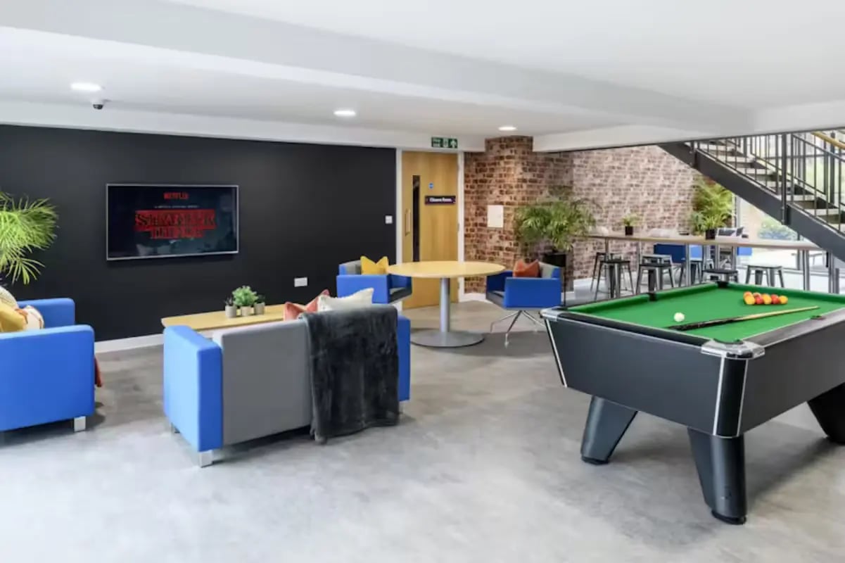 Pool table and lounge seating common area at The Elements in Sheffield Student Accommodation