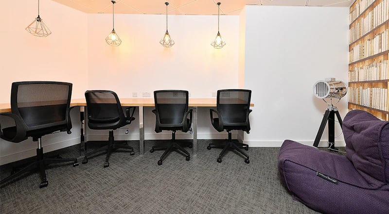 Four black chairs at desk with beanbag study area at 88 Bromsgrove House in Birmingham Student Accommodation