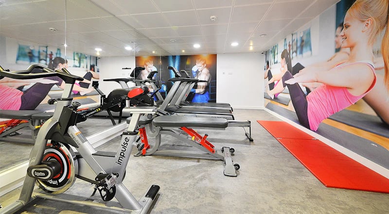 Exercise bikes weight machines red mats gym at 88 Bromsgrove House in Birmingham Student Accommodation