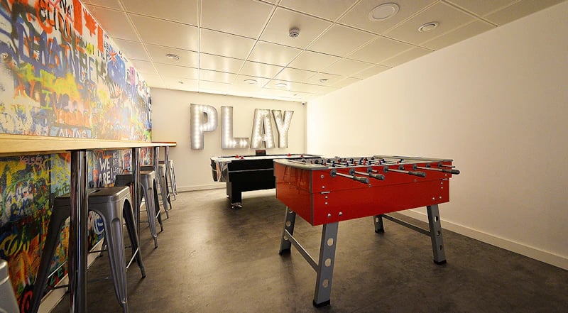 Foosball pool tables graffiti wall PLAY sign area at 88 Bromsgrove House in Birmingham Student Accommodation