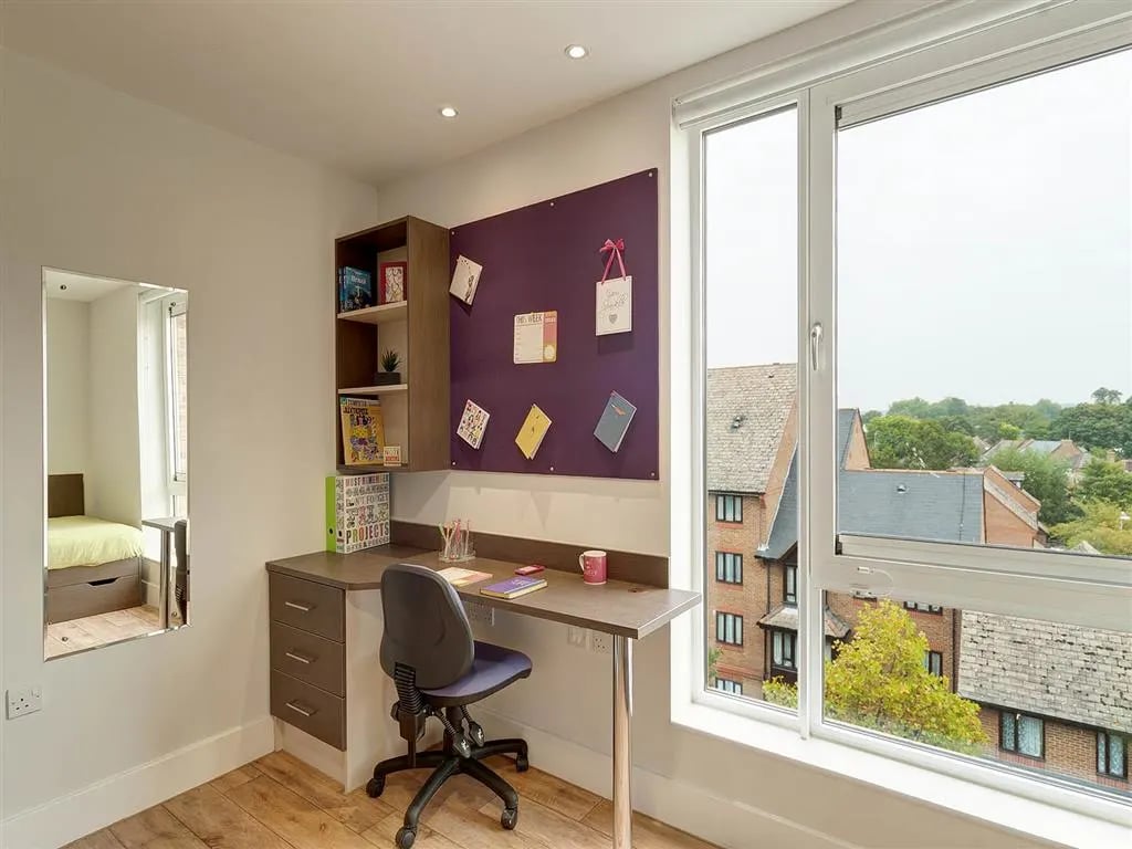 Desk with chair and bulletin board study area at Davidson House in Kingston Upon Thames Student Accommodation