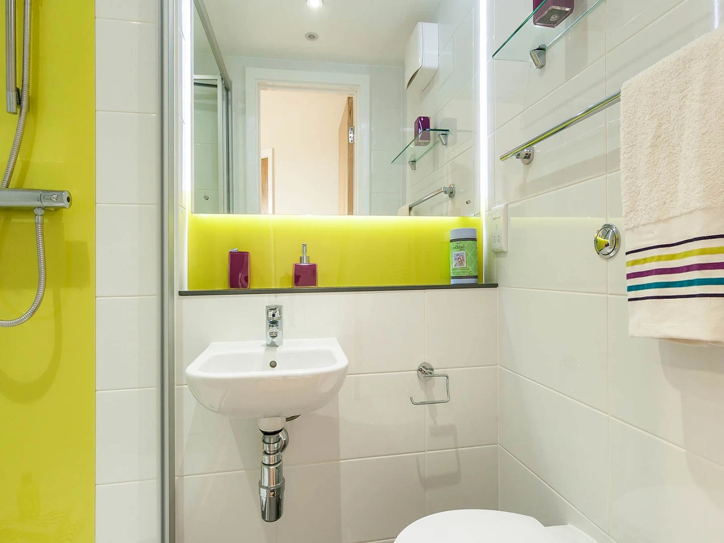 Sink shower dispensers towel rack and toilet bathroom at Davidson House in Kingston Upon Thames Student Accommodation