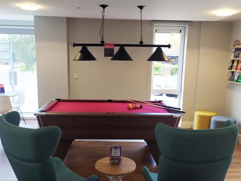 Pool table with cues and balls playing area at Davidson House in Kingston Upon Thames Student Accommodation