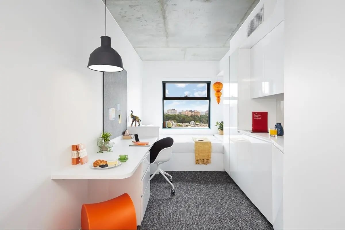 Desk bed and kitchen area Studio room at Scape Carlton in Melbourne Student Accommodation