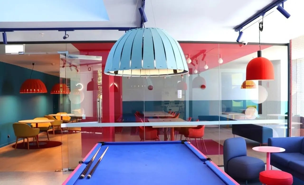 Pool table colorful lamps tables chairs shared area at Scape Carlton in Melbourne Student Accommodation