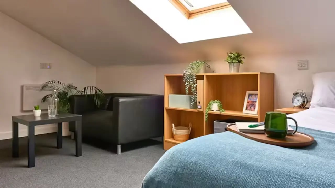 Sofa bookcase bed and tray bedroom at The Apollo Works in Coventry Student Accommodation