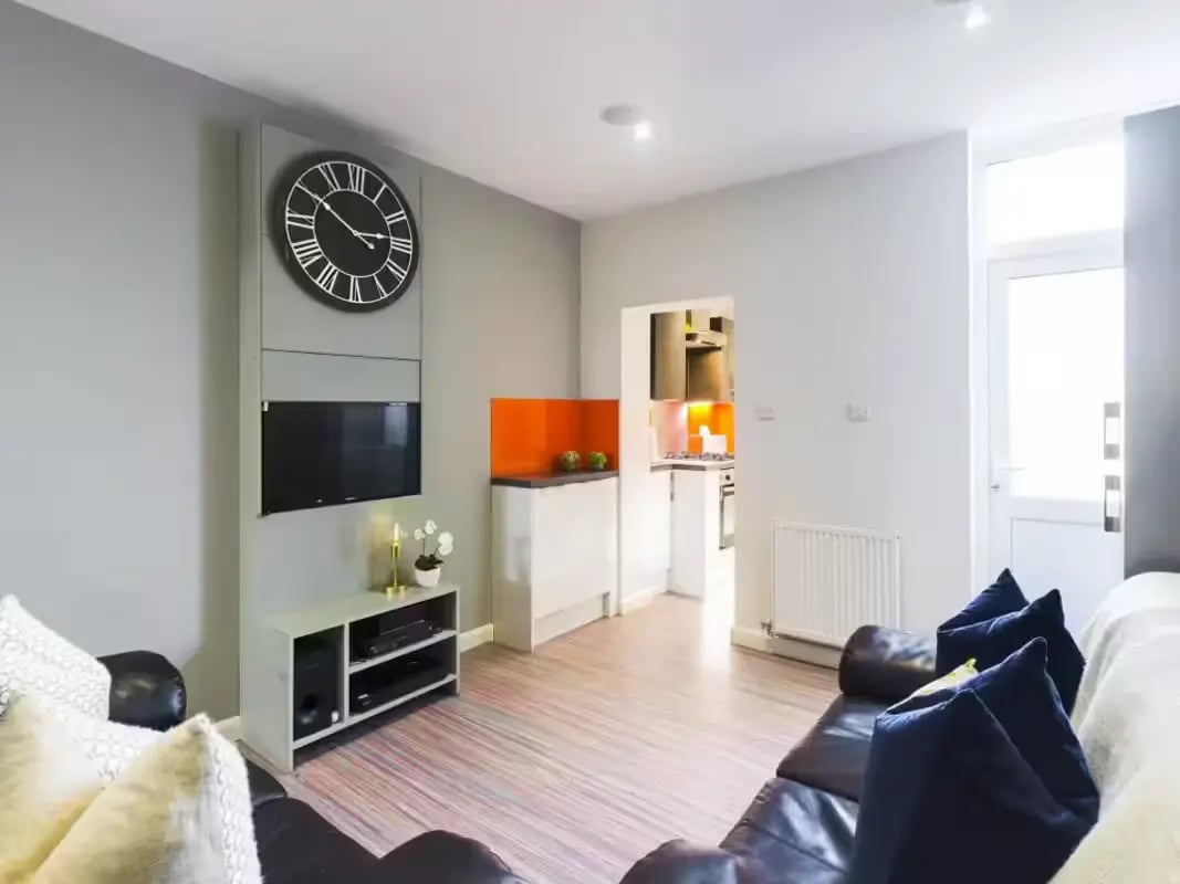 Sofa television clock kitchen living room at 93 Thornton Road in Stoke-On-Trent Student Accommodation