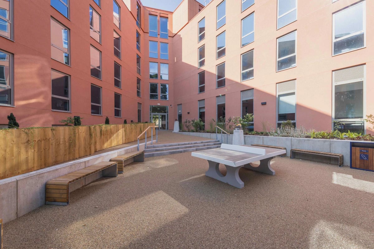 Ping pong table benches and building exterior at Pershore Junction in Birmingham Student Accommodation