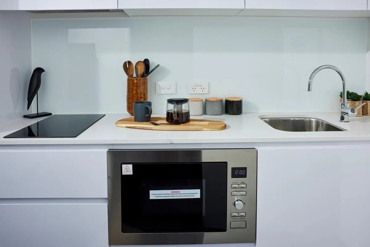 Microwave induction hob sink and utensils kitchen at Scape Redfern in Sydney Student Accommodation