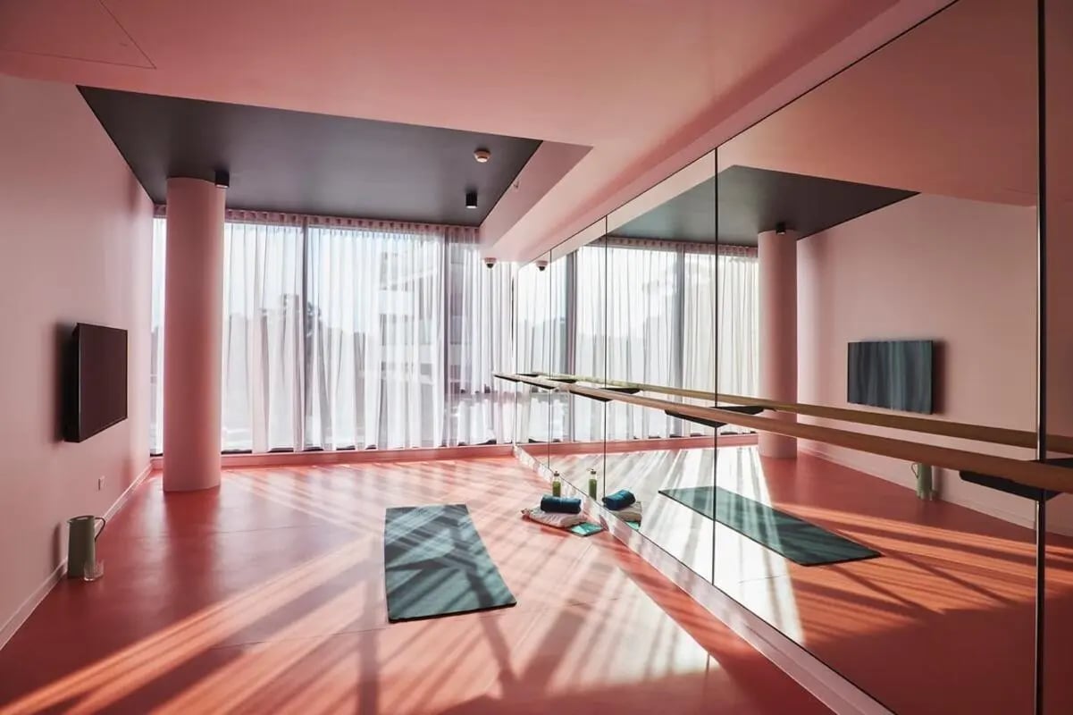 Yoga mats and mirrors workout room at Scape Redfern in Sydney Student Accommodation