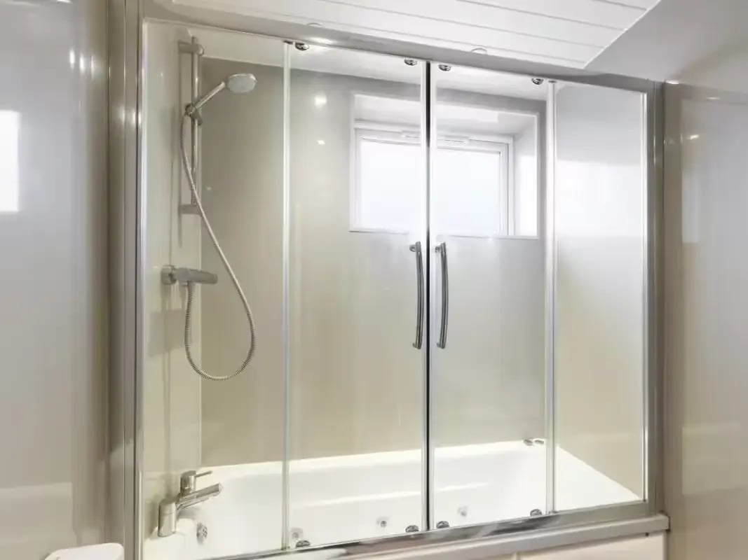 Showerhead bath tub sliding glass doors bathroom at 41 Crowther Street in Stoke-On-Trent Student Accommodation