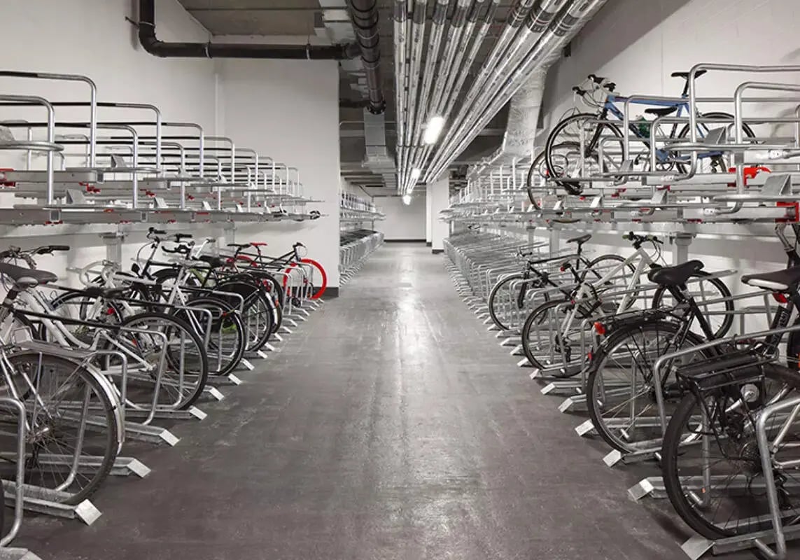 Many bicycles parked in rows bike storage exterior. at iQ Shoreditch in London Student Accommodation