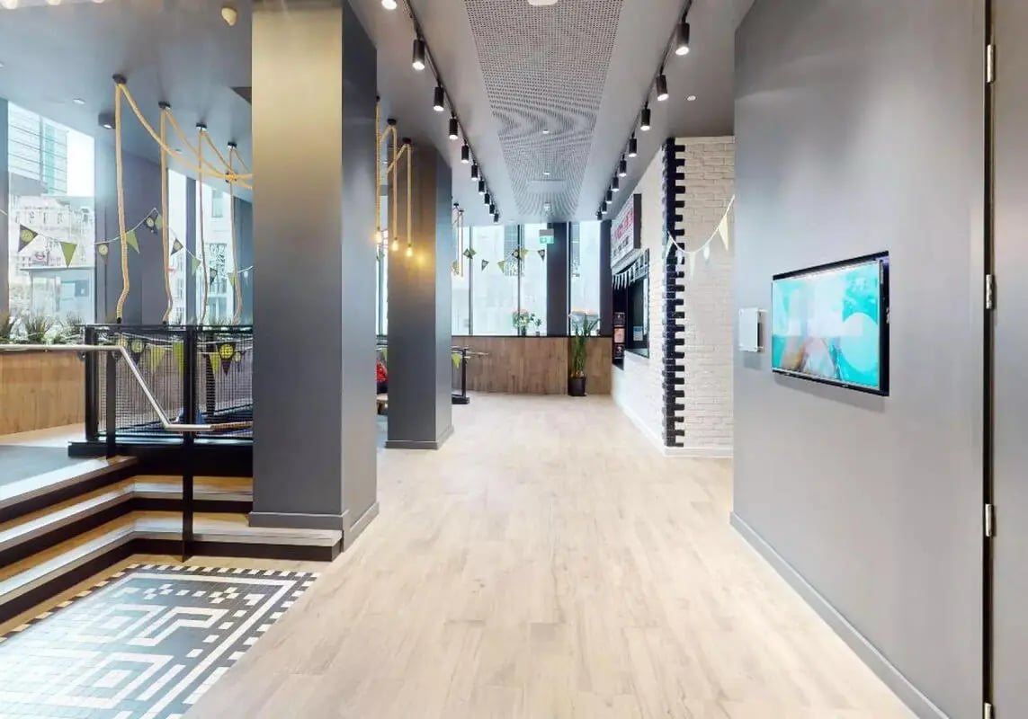 Hallway with rope swings and TV screen interior at iQ Shoreditch in London Student Accommodation