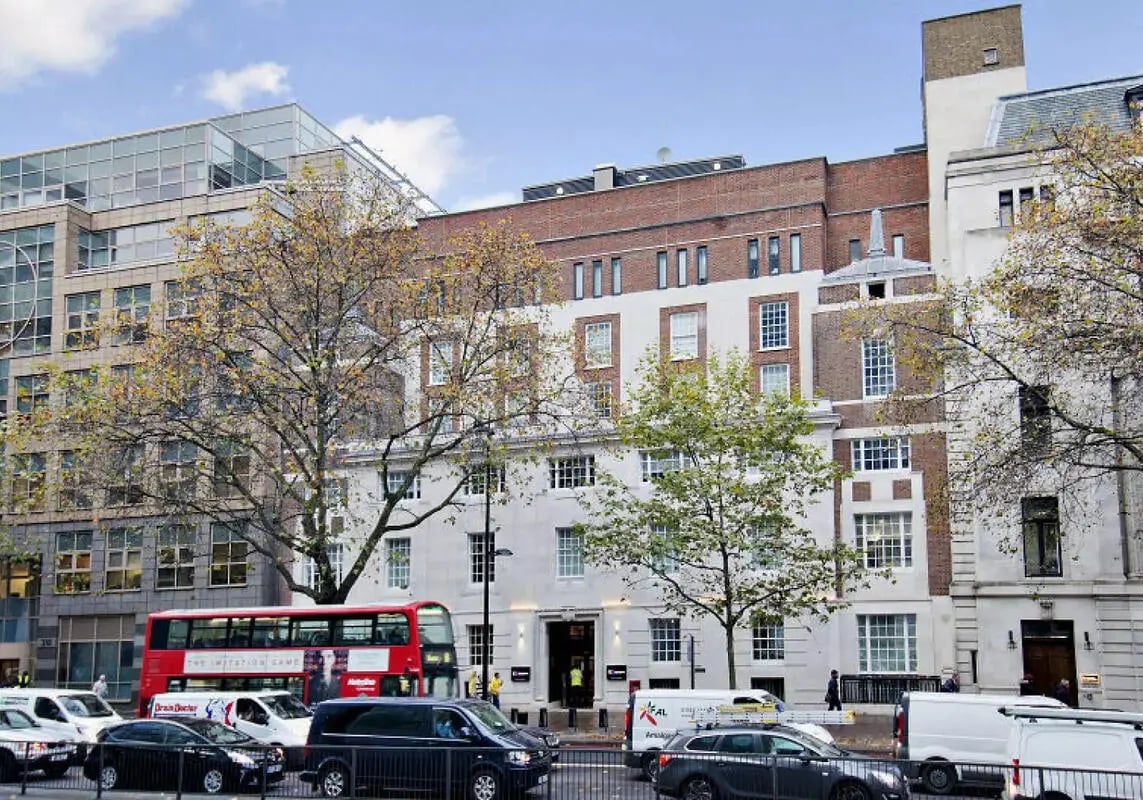 Brick and white building entrance street exterior at iQ Bloomsbury in London Student Accommodation