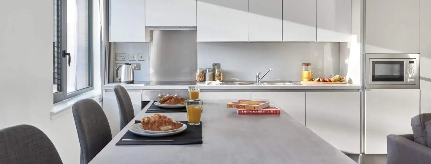 Kitchen with breakfast table and microwave kitchen at The Glassworks Leicester in Leicester Student Accommodation