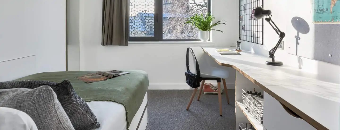 Bed desk chair and window student bedroom at The Glassworks Leicester in Leicester Student Accommodation