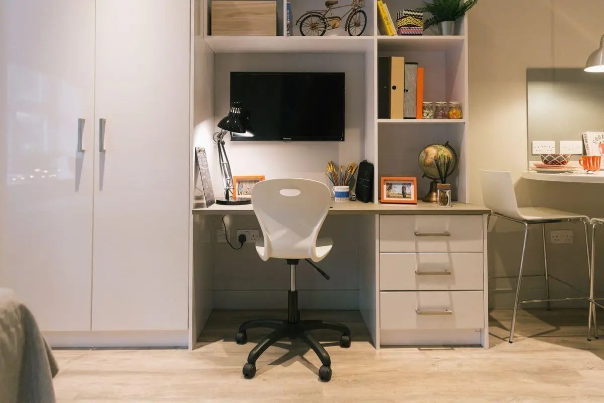Desk lamp television chair drawers globe study area at Kingsmill Studios in Huddersfield Student Accommodation