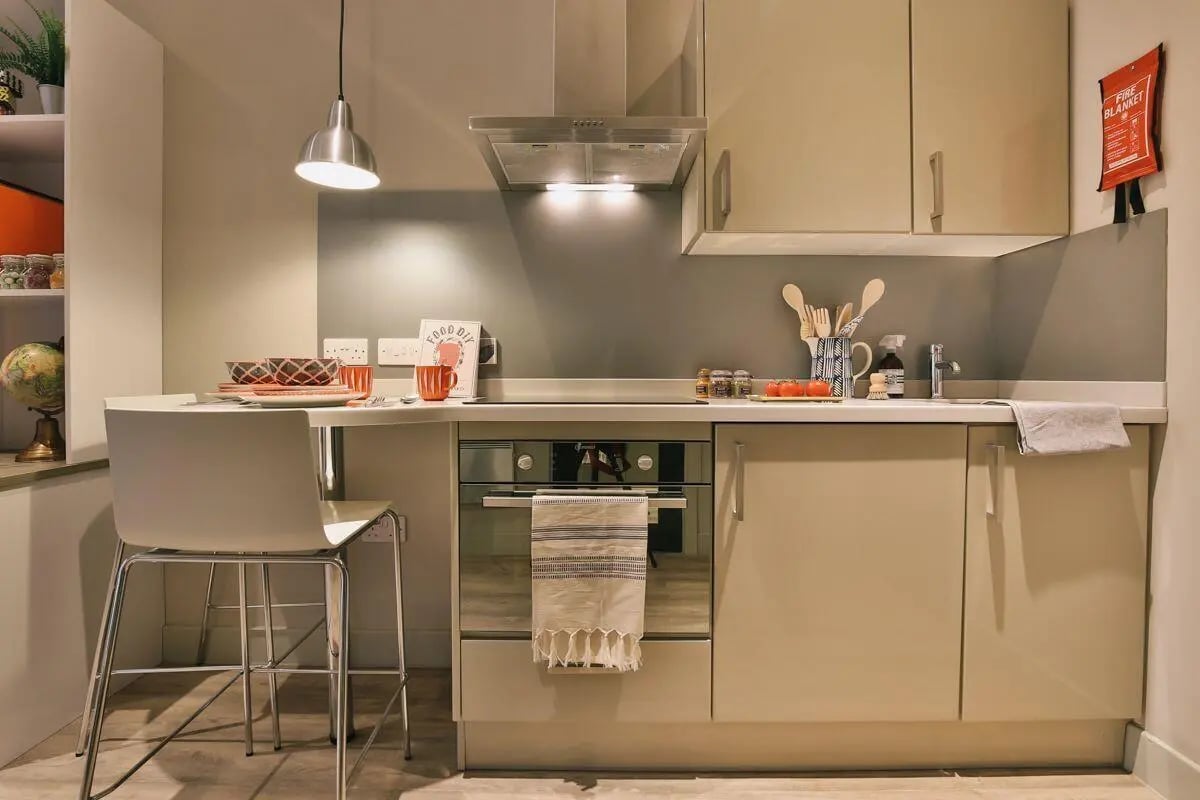 Modern kitchen with seating area and oven kitchen at Kingsmill Studios in Huddersfield Student Accommodation