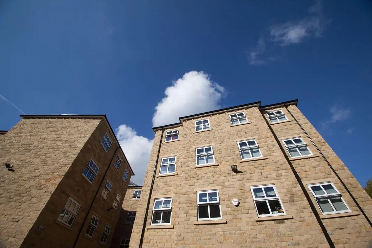 Stone brick buildings with many windows exterior at Kingsmill Studios in Huddersfield Student Accommodation