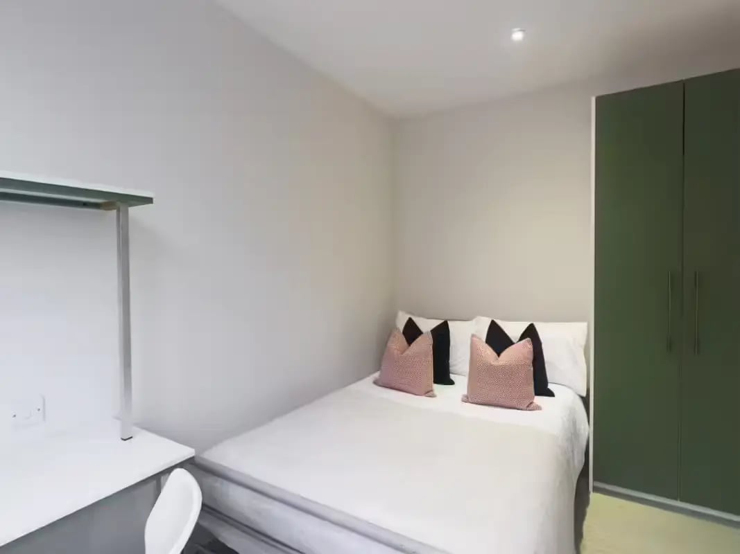 Bed desk pillows green wardrobe bedroom at 31 Guildford Street in Stoke-On-Trent Student Accommodation