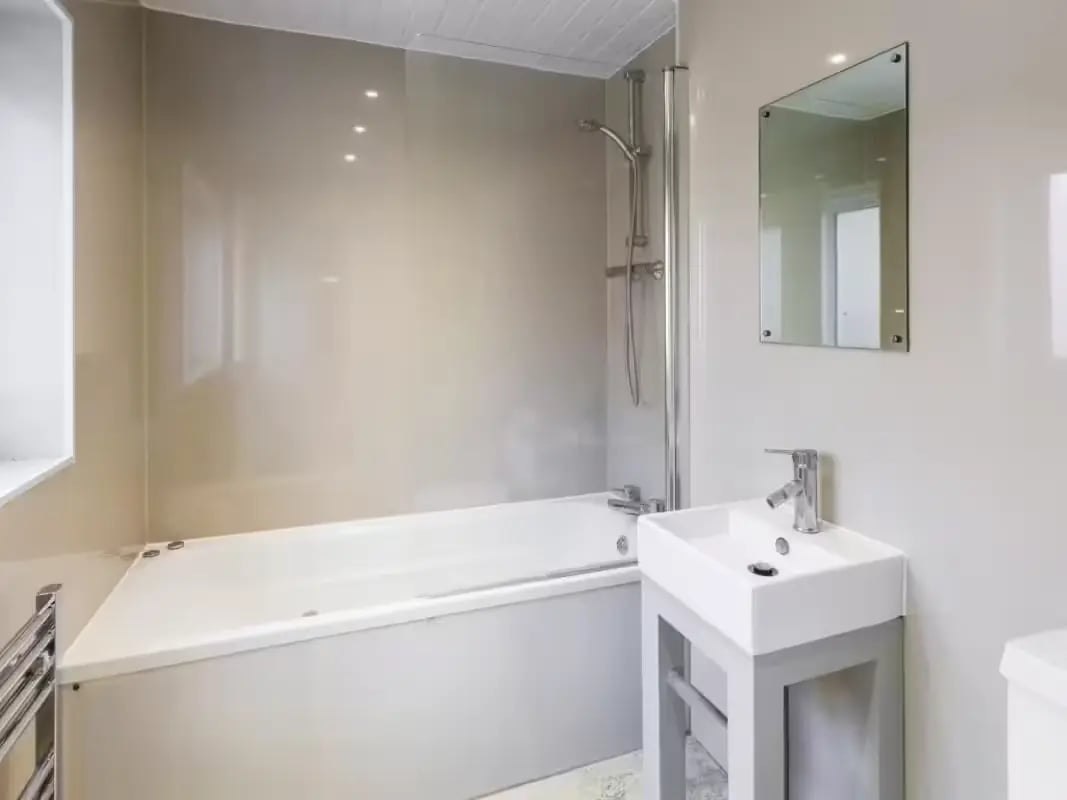 Bathtub sink mirror and shower visible bathroom at 31 Guildford Street in Stoke-On-Trent Student Accommodation