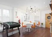 Foosball table dining tables communal area lounge at Louise House in London Student Accommodation