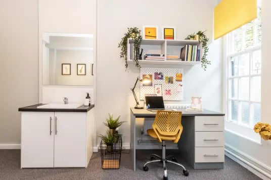 Sink desk chair and shelves study area at Louise House in London Student Accommodation