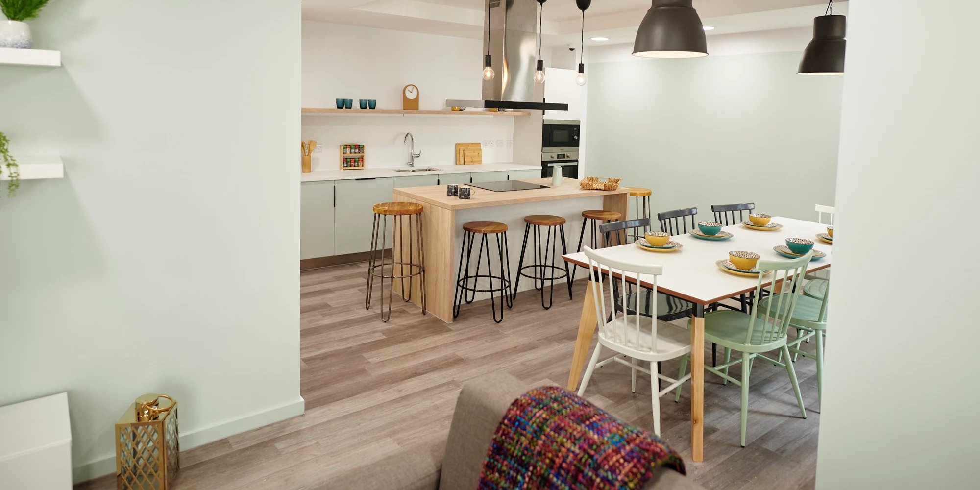 Dining area with kitchen island and chairs kitchen at Canvas Bristol in Bristol Student Accommodation