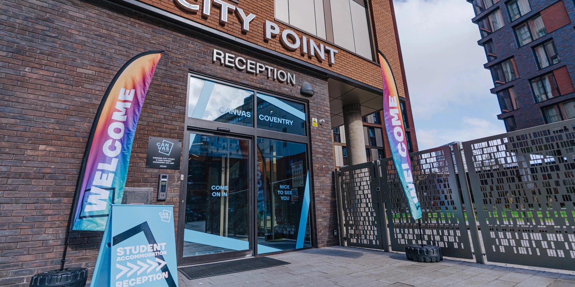Welcome flags student accommodation reception exterior at Canvas Coventry City Point in Coventry Student Accommodation