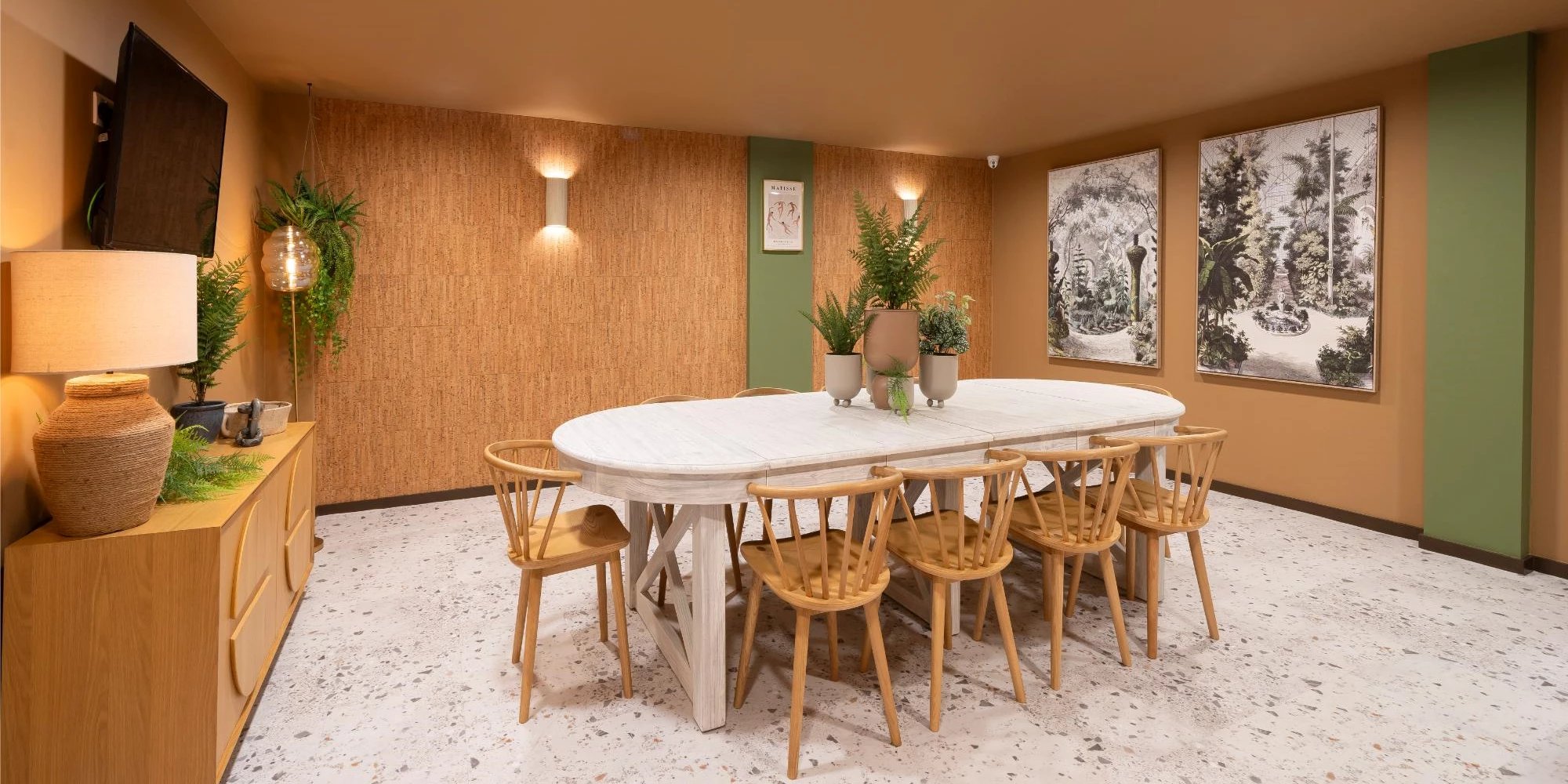 Dining table with chairs and artwork dining room at Canvas Glasgow in Glasgow Student Accommodation