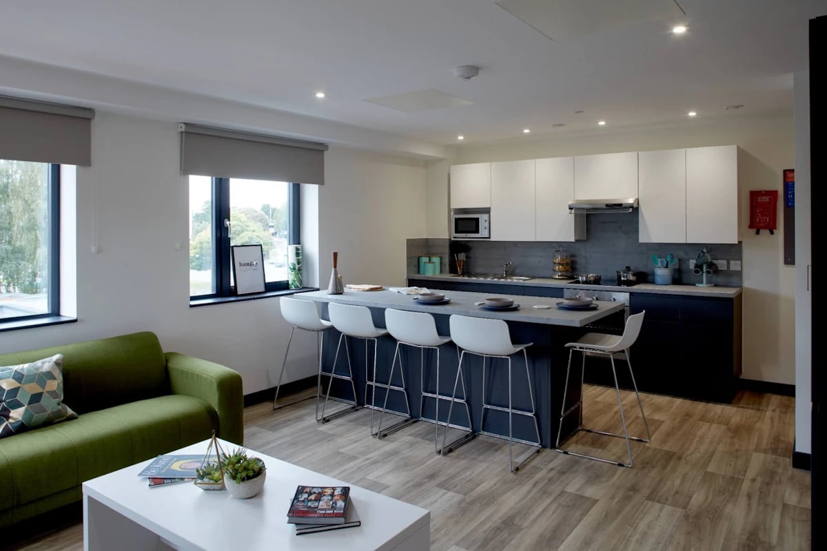 Sofa counter with stools and kitchen cabinets Kitchen at Eden Square in Coventry Student Accommodation