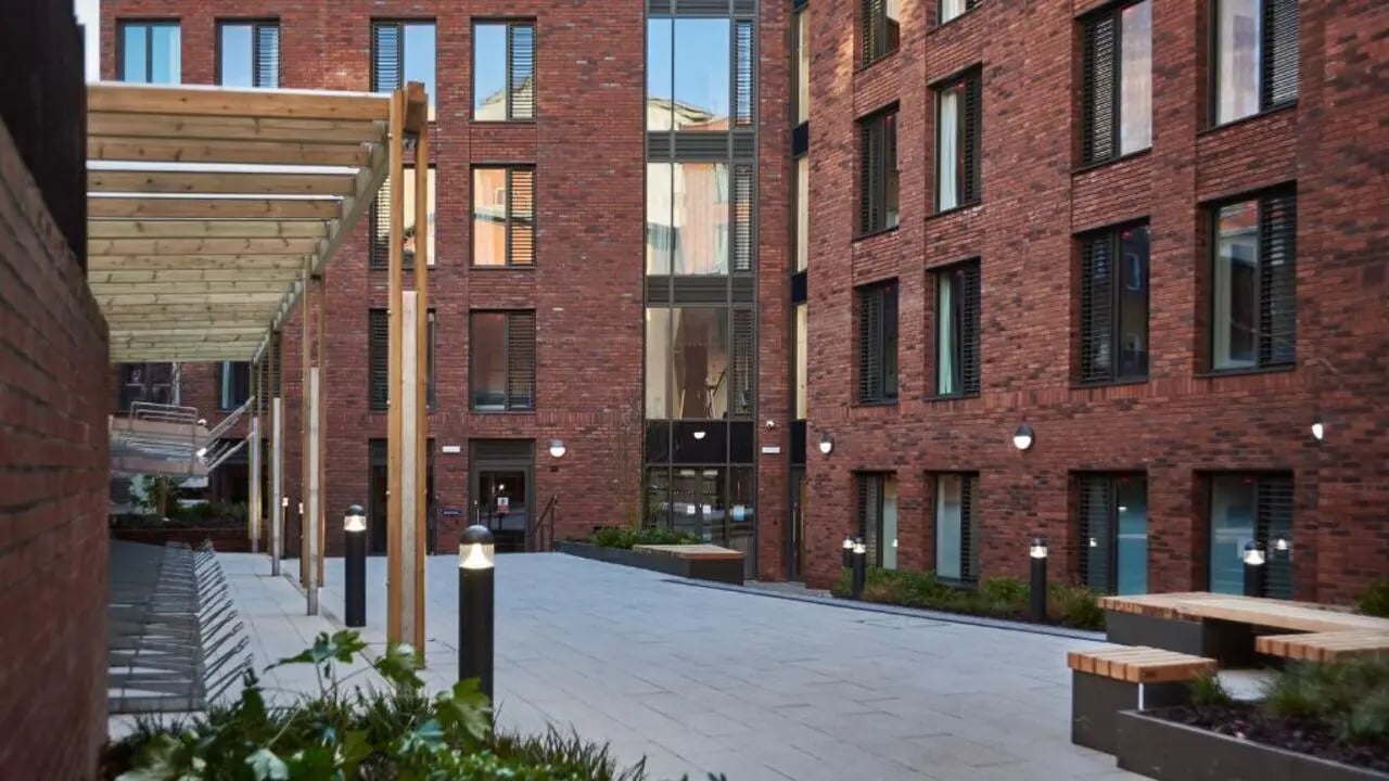 Brick building with courtyard seating exterior at 41 Castle Street in Leicester Student Accommodation