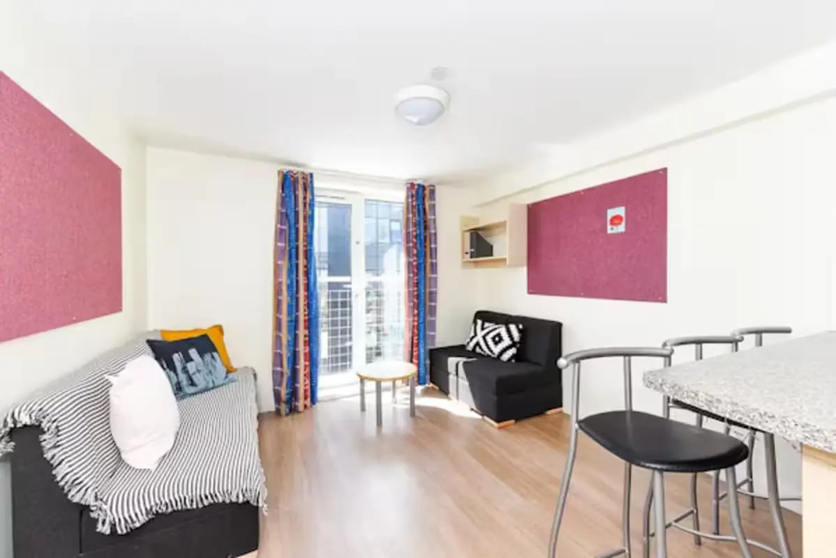 Sofa two cushions table and stools living room at Portsburgh Court in Edinburgh Student Accommodation