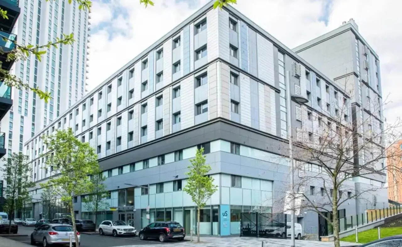 Modern building with windows and trees exterior at Emily Bowes Court in London Student Accommodation