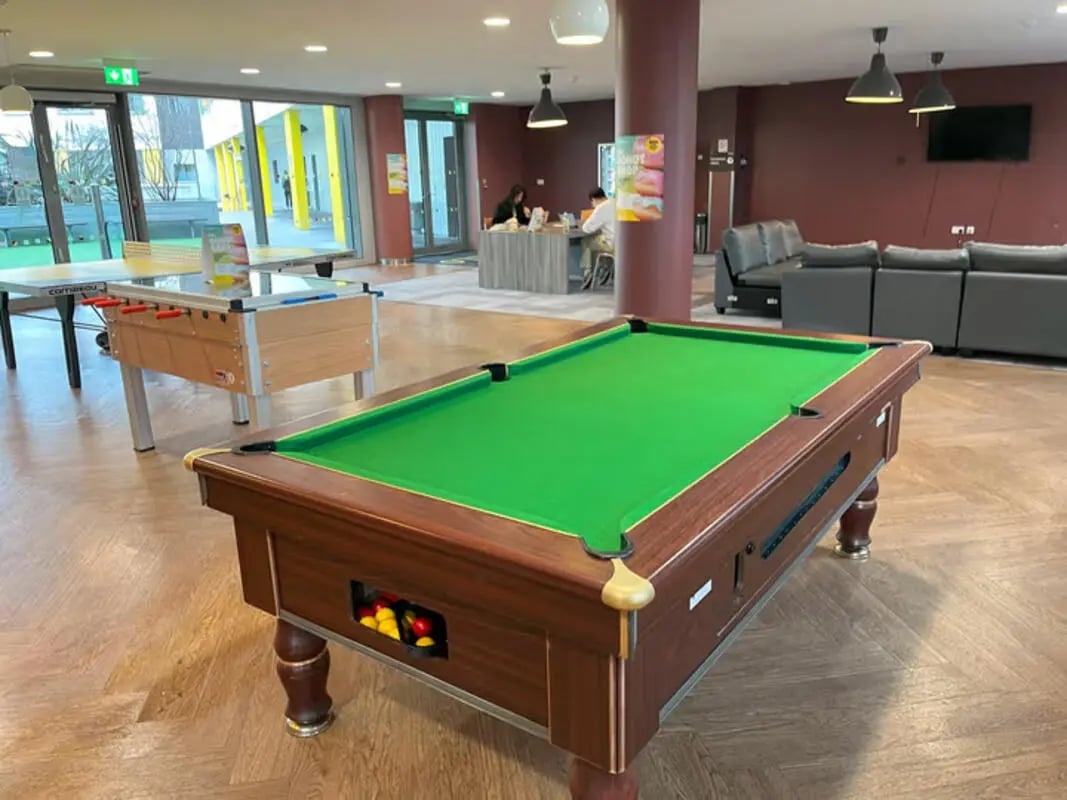 Pool table and foosball table common area at Emily Bowes Court in London Student Accommodation
