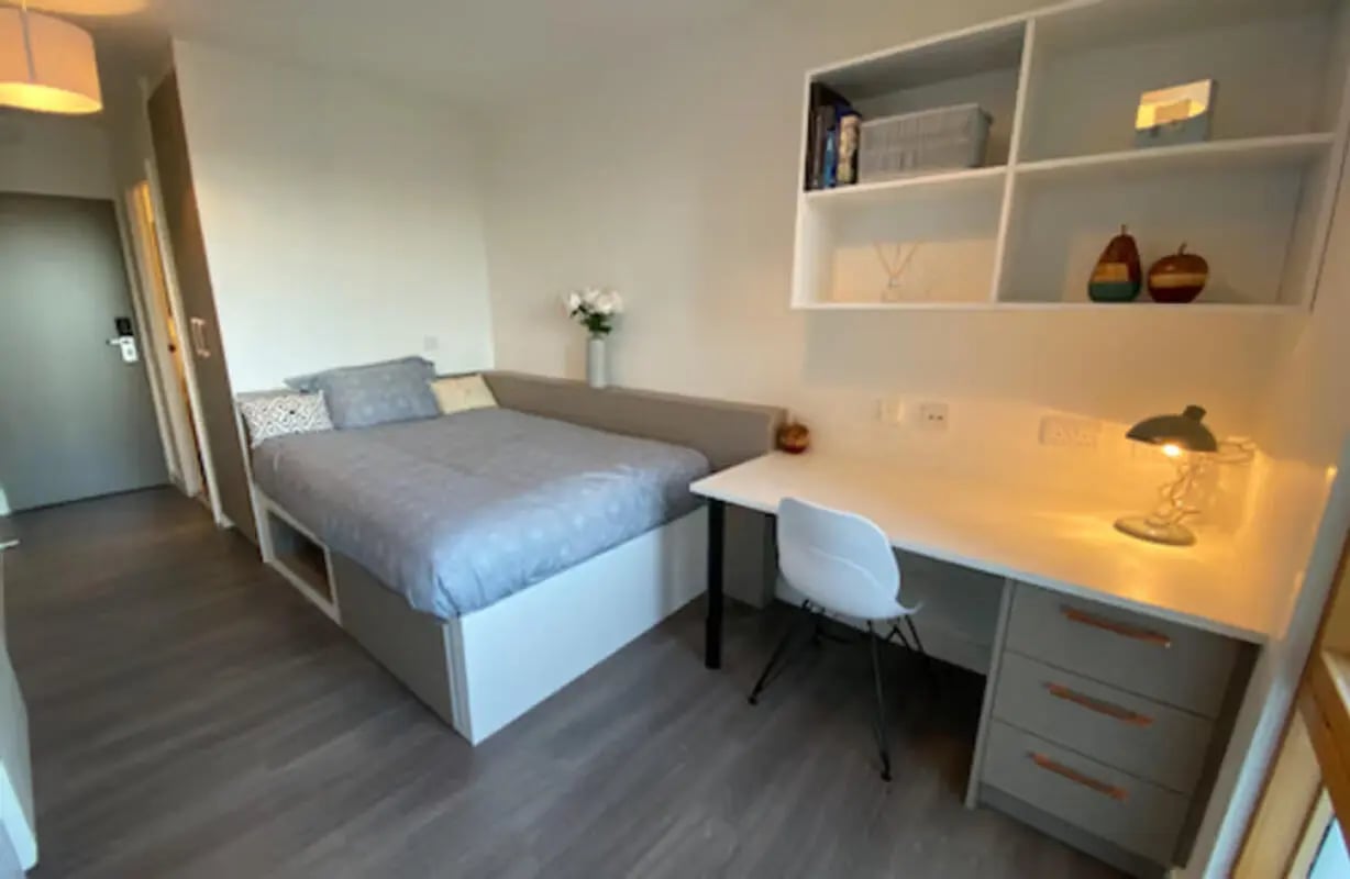 Bed desk chair shelves lamp bedroom at Charles Morton Court in London Student Accommodation