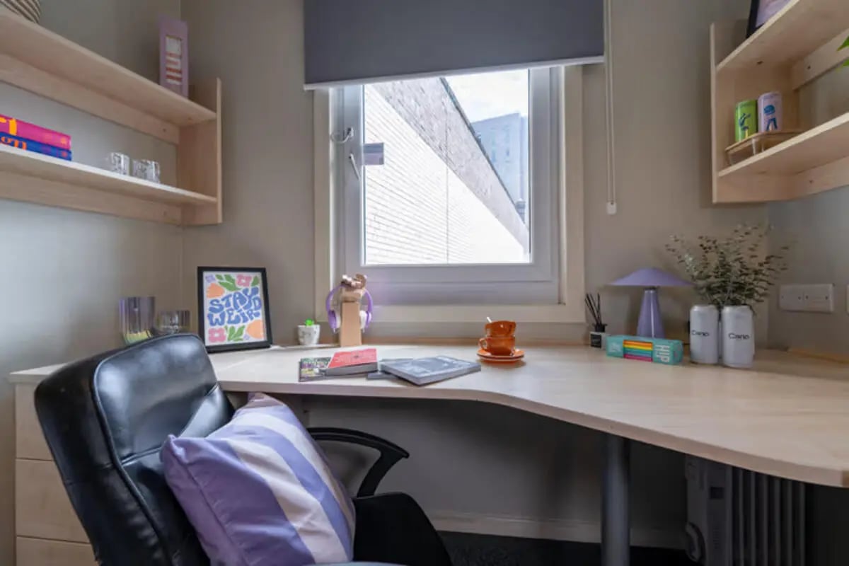 Desk chair picture frame lamp cans study area at The Heights in Birmingham Student Accommodation