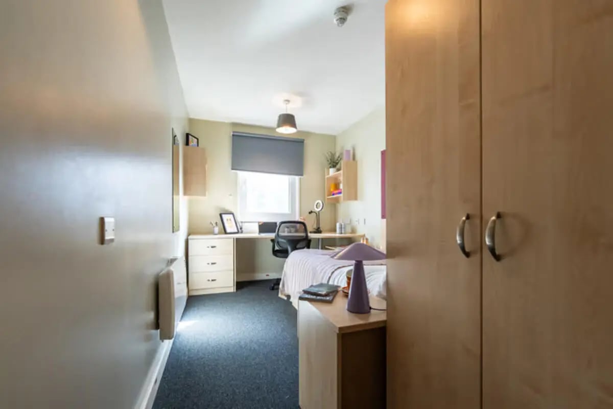 Bed desk wardrobe and shelves bedroom at The Heights in Birmingham Student Accommodation